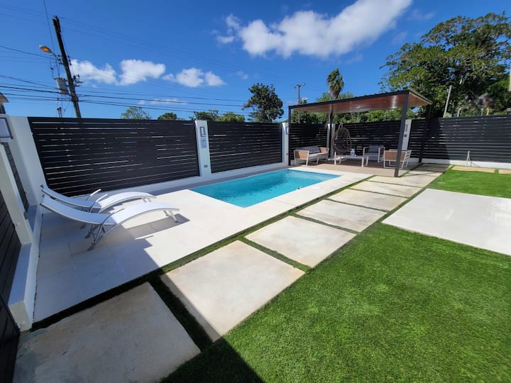 Pool and garden at Isabela Escape House behind privacy walls